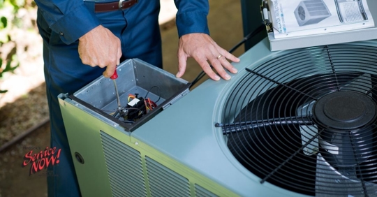 HVAC technician repairing an AC unit.